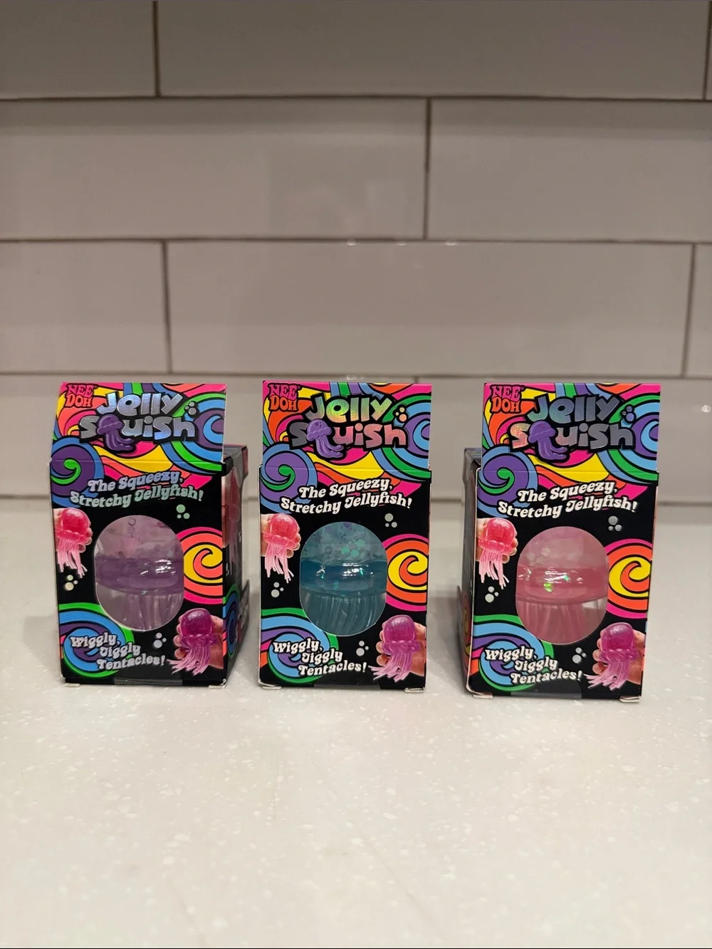 NeeDoh Jelly Squish Sensory Toy - Set of three. Purple, Blue, Pink NEW
